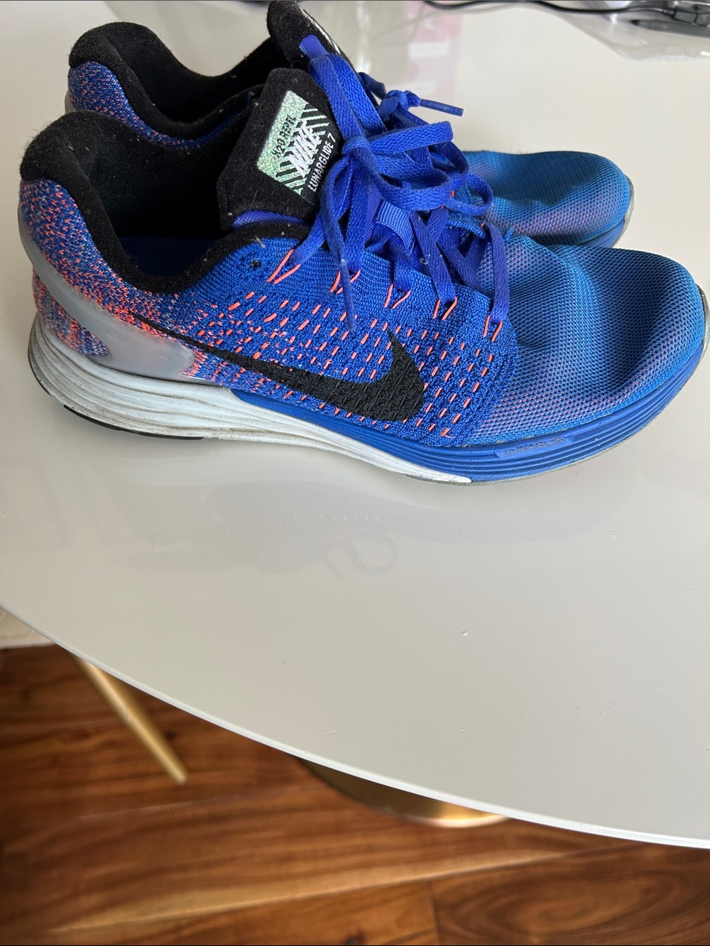 Nike woman’s Lunarglide 7 Blue Sneakers with Black and orange Accents size 8